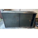 A nice DECORATIVE COMMERCIAL c1950's solid green factory painted metal two door cabinet with six