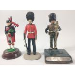 Three hand-painted figures of Scottish soldiers to include a SCOTS GUARD PIPER (10cm tall), a