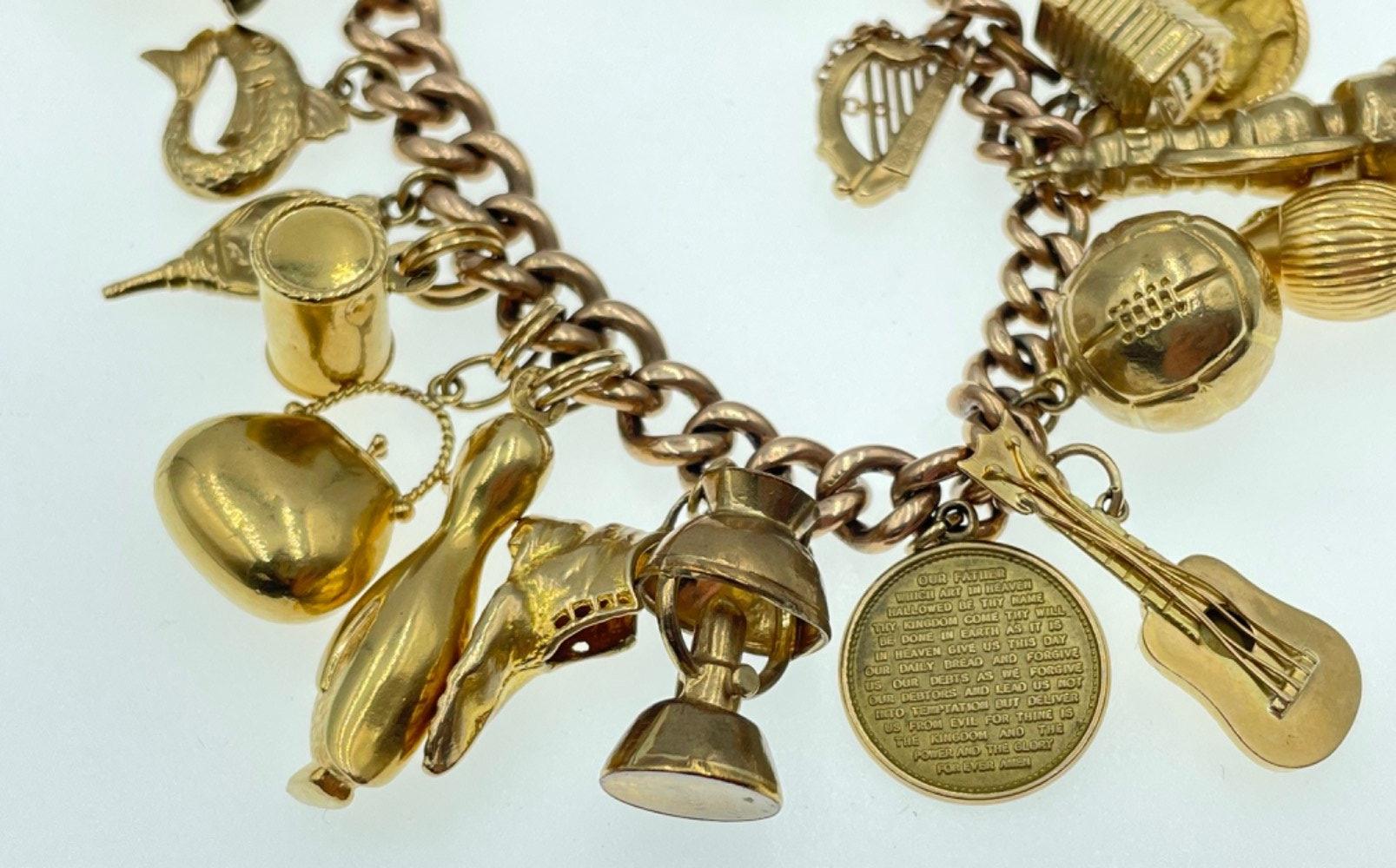 LOTS OF CHARMS!A 375 stamped gold charm bracelet , the 375 is partially rubbed, with most charms - Image 12 of 48