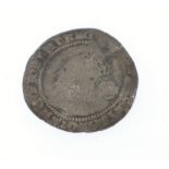 FOUND IN A PEEBLES GARDEN!A hammered silver Queen Elizabeth sixpence coin with the Queens head