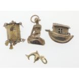 Small collection of four Hallmarked YELLOW GOLD charms to include a Dolphin, The Ark, Mermaid and