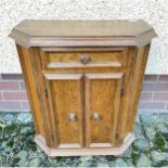 A sturdy medium sized two door oak veneer cabinet with three shelves and a top drawer - 2.5ft long