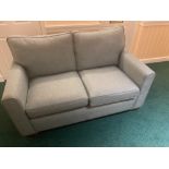 A two seater modern couch and matching armchair - almost new!