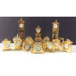 Large collection of 18 miniature brass clocks of various designs, to inlude 2 grandfather and a