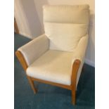 An almost new easy chair in cream fabric