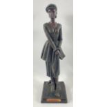 A large CROSA female golfer cold cast bronze effect figure from the Juliana Collection, label on