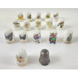 A collection of ceramic thimbles to include a series of six 'WILD BIRDS', five 'BUTTERFLY', some