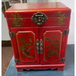 An ORIENTAL HIGHLY decorative red and gold painted and dragon patterned, lacquered red based 2