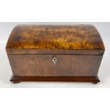 A vintage WALNUT lockable box with a rounded top and 4 bun feet, retains its original key