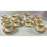 A vintage ART DECO SHELLEY part tea service, pattern no 12496 with orange and yellow dahlias,