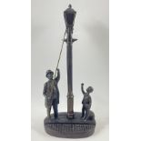 A vintage GENESIS (E/5000) fine arts bronze lamplighter with a boy and small dog stands 31cm tall