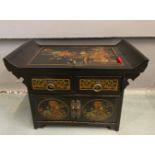 An ORIENTAL HIGHLY decorative black and gold painted and floral lacquered black based 2 drawer