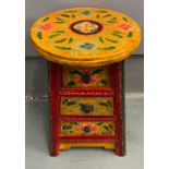 An ORIENTAL HIGHLY decorative yellow painted and floral lacquered red based 3 drawer stool/side