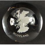 A boxed EDINBURGH CRYSTAL paperweight with a design of the map of Scotland (7.5cm dia at base)