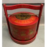 An ORIENTAL HIGHLY decorative red and gold painted lacquered layer with carry handle mock food