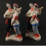 A vintage pair of USSR figurines with man playing the mandolin each stands 18cm tall