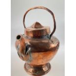 A vintage copper kettle standing 35cm tall