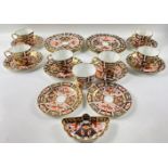 A ROYAL CROWN DERBY tea service in the traditional Amari pattern to include 7 cups (1 cracked), 8