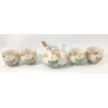 A vintage ORIENTAL four cup and teapot set featuring large white blossom pattern with crackleware