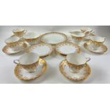 A ROYAL STANDARD gold filigree tea service comprising 6 each of cups, saucers, side plates, milk