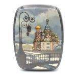 A Russian laquered snuff box with a design of St Basil's cathedral 10cm long