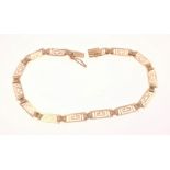 An attractive 19cm long Aztec key bracelet stamped 585, gross weight 4.0g