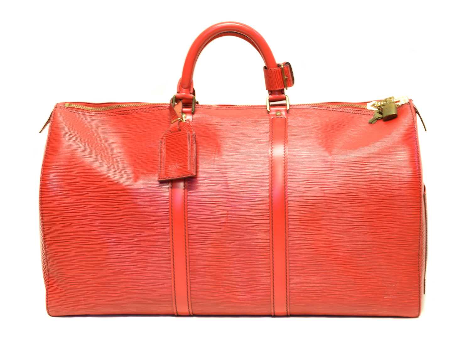 A Louis Vuitton red Epi Keepall 50 luggage bag,