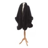 A fur tipped wool cape,