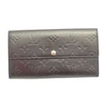 A Louis Vuitton Porte-Monnaie wallet,