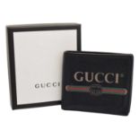 A Gucci Logo Bifold Wallet,