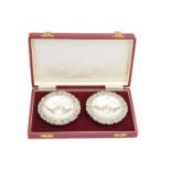 A pair of Elizabeth II cased silver candlesticks,