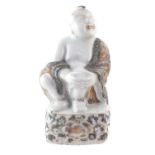 Chinese figure of a seated boy in a Wucai robe