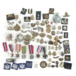 Approximately seventy five Cap badges