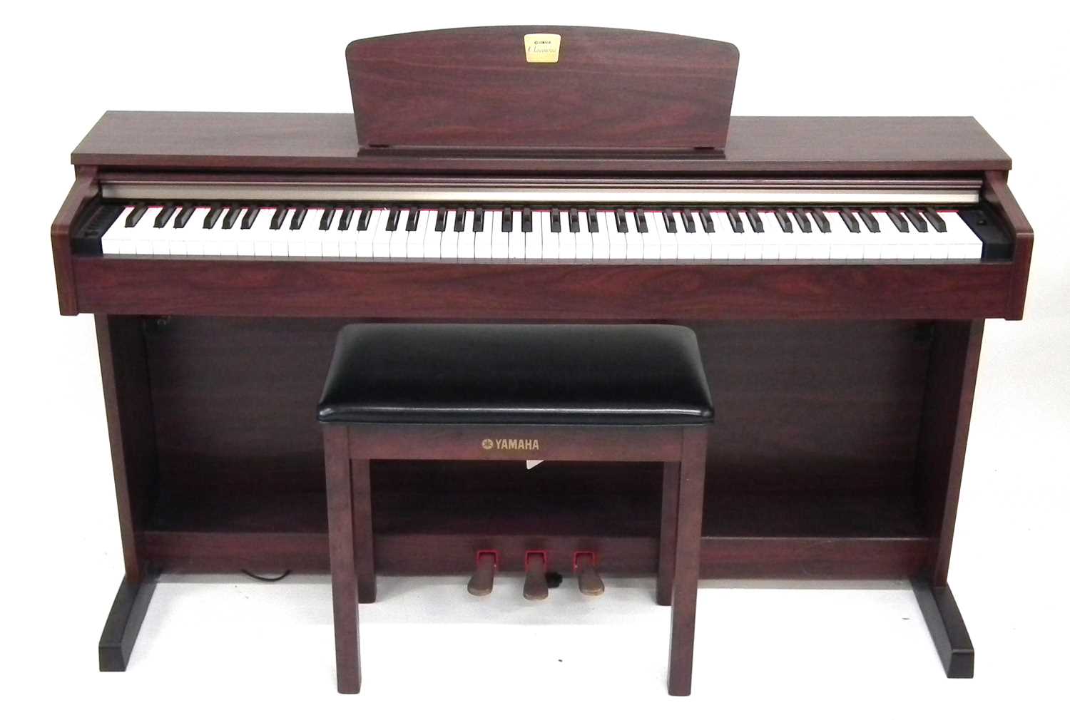 Yamaha Clavinova electric piano, with stool and Sanyo headphones.