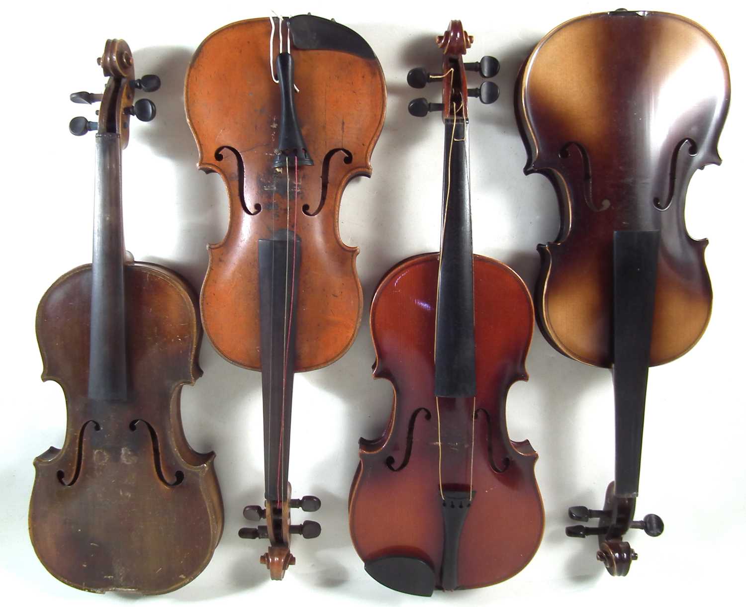 Four violins in cases