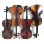 Four violins in cases