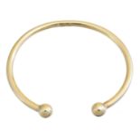 A 9ct gold torque bangle,