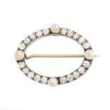 An early 20th century diamond and pearl brooch,