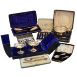 A selection of cased silver items,