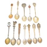 A selection of silver, enamel and white metal souvenir spoons,