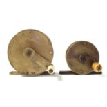 Two brass fishing reels,