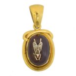 A Victorian foil back garnet and diamond bug pendant,