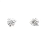 A pair of brilliant cut diamond stud earrings,