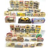 A collection of 66 boxed vehicle models and diecast cars, busses, vans, boats etc. Makers include