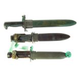 Three bayonets and scabbards,