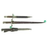 Three bayonets and scabbards,