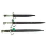 Three Argentinian bayonets and scabbards