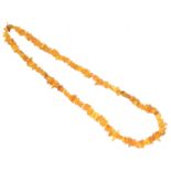 An amber bead necklace,