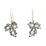 A pair of diamond earrings,