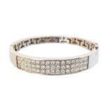 An 18ct gold diamond hinged bangle,